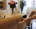 Professional cleaner tidying a bright New York apartment