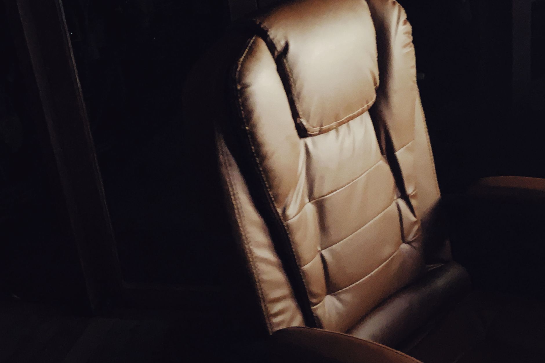 Close-up of a padded brown office chair